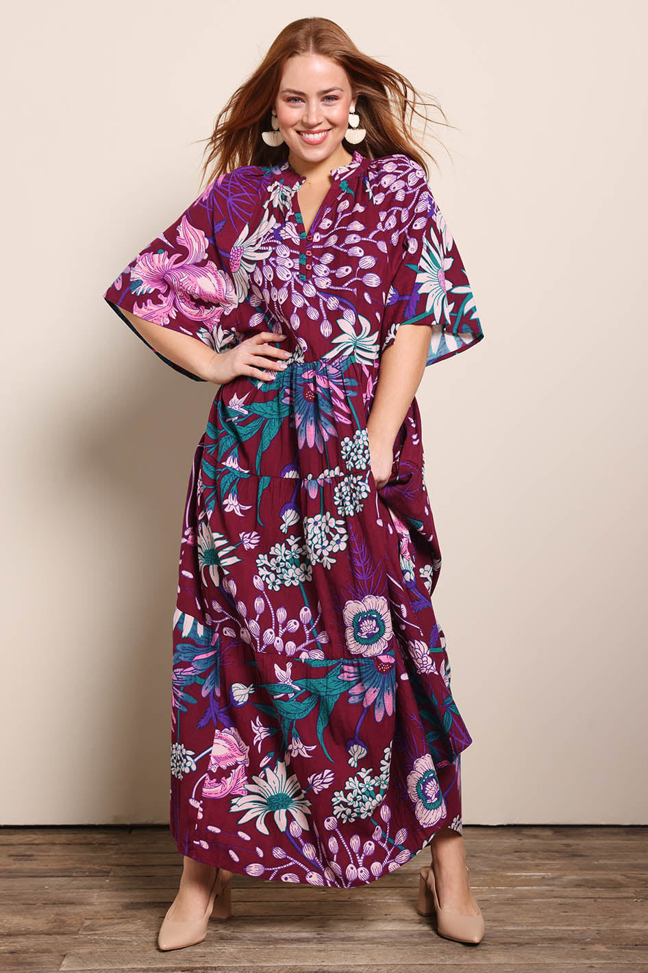 Model Georgiel wearing size 10 of the Katherine Cotton Tired Dress – Garden in colour Garden, from the front
