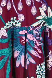 Product shot of the Katherine Cotton Tired Dress – Garden in colour Garden, showing detail