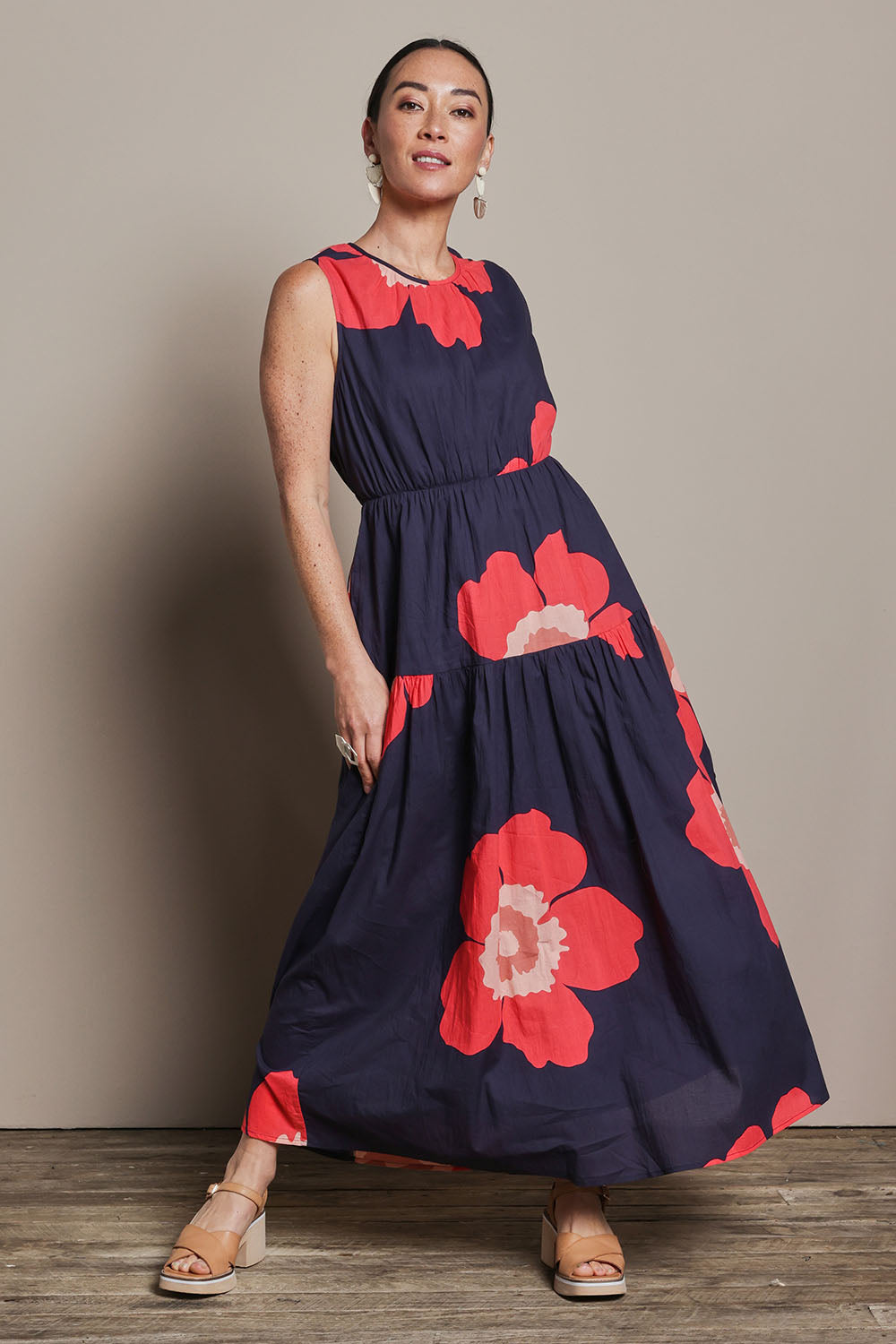 Model Katie wearing size 10 of the Riley Cotton Maxi Dress in colour Boldflower (Blue), from the front, showing the whole outfit