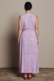 Model Katie wearing size 10 of the Georgina Wrap Dress in colour Labyrinth (Purple), from the back