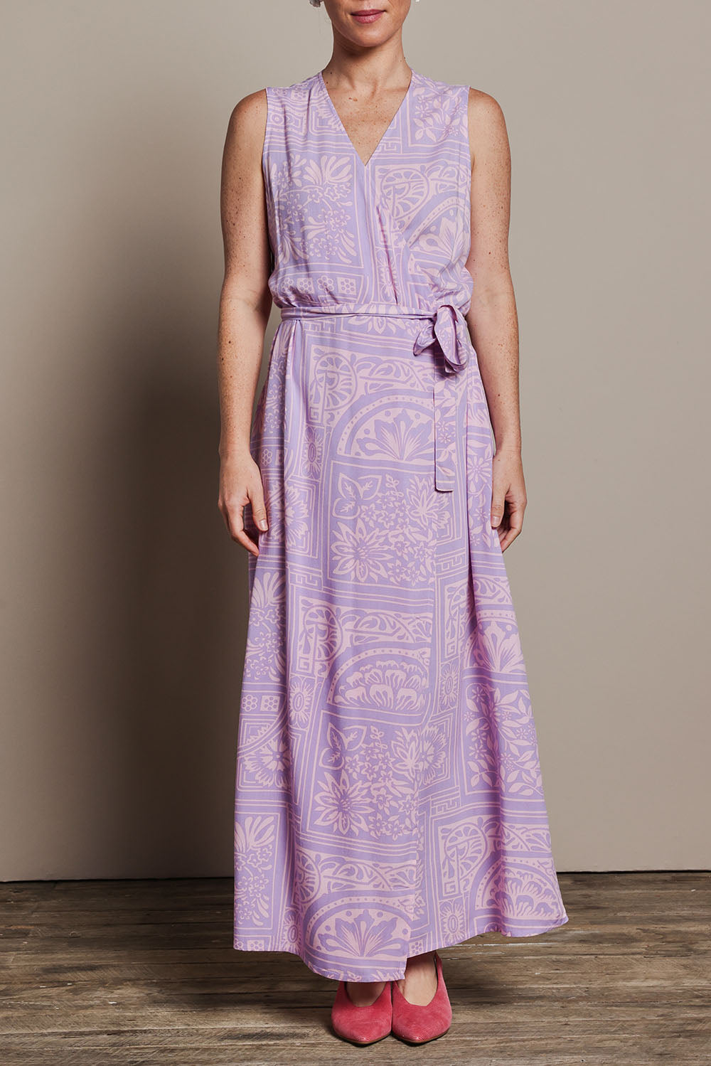Model Katie wearing size 10 of the Georgina Wrap Dress in colour Labyrinth (Purple), from the front, cropped image