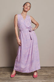 Model Katie wearing size 10 of the Georgina Wrap Dress in colour Labyrinth (Purple), from the front, showing the whole outfit