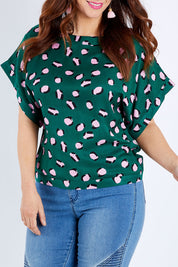Model Laura wearing size 14 of the Lola Belle Sleeve Top in colour Leopard (Green), from the front, cropped image