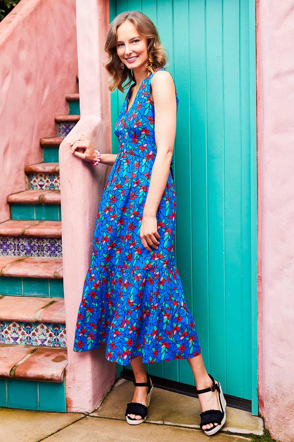 Model Alex wearing size 10 of the Scarlet Summer Dress Kaleidoscope in colour Blue (Blue), from the front, showing the whole outfit