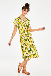 Model Courtney wearing size 10 of the Caroline Drawstring Waist Dress in colour Floral, from the front, showing the whole outfit
