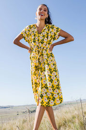Model Vitoria wearing size 10 of the Caroline Drawstring Waist Dress in colour Floral, from the front, showing the whole outfit