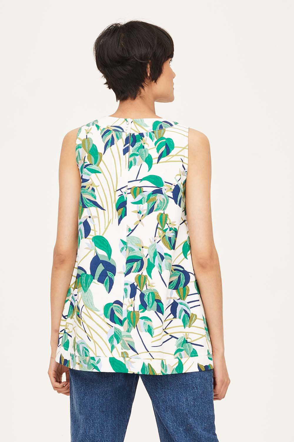 A model wearing the London Fields Pleat Front Top in colour Vanillacre (White), from the back