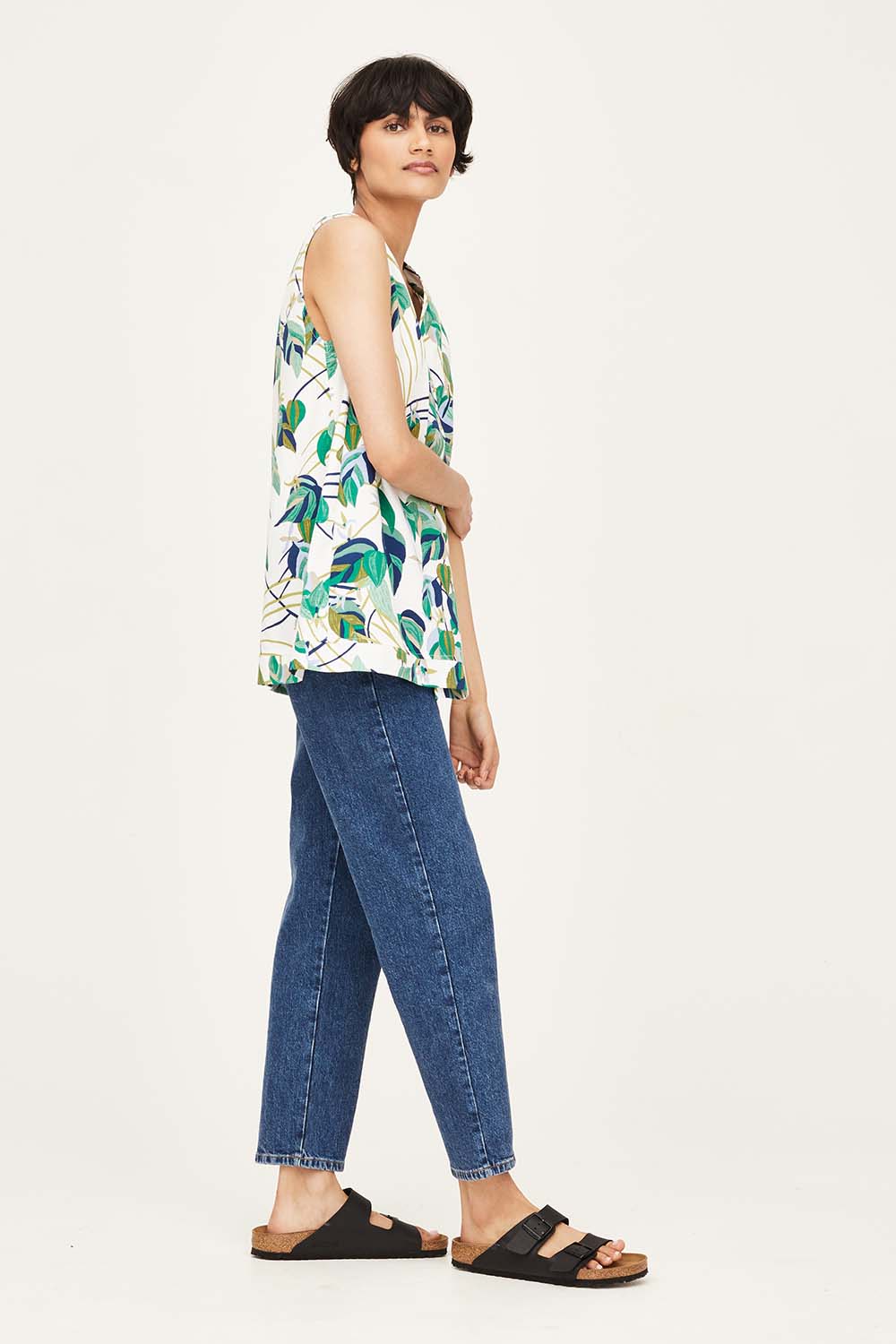 A model wearing the London Fields Pleat Front Top in colour Vanillacre (White), from the front, showing the whole outfit
