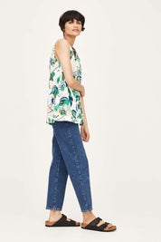 A model wearing the London Fields Pleat Front Top in colour Vanillacre (White), from the front, showing the whole outfit
