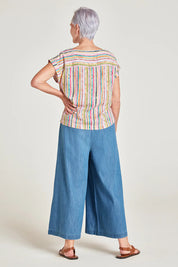 A model wearing the Melinoe Lenzing Ecovero Top in colour Multi (Pink), from the back