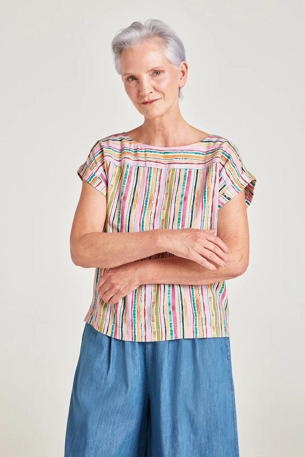 A model wearing the Melinoe Lenzing Ecovero Top in colour Multi (Pink), from the front, cropped image
