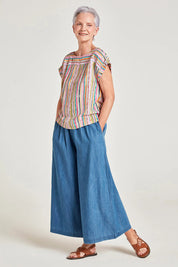 A model wearing the Melinoe Lenzing Ecovero Top in colour Multi (Pink), from the front, showing the whole outfit