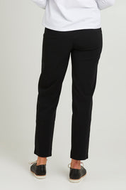 Model Emma wearing size S of the Pull On Pant in colour Black (Black), from the back