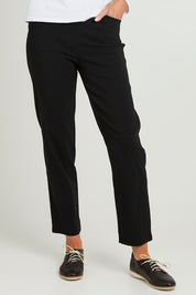 Model Emma wearing size S of the Pull On Pant in colour Black (Black), from the front, cropped image