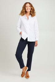 Model Emma wearing size S of the Pull On Pant in colour Navy (Blue), from the front, showing the whole outfit