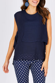 Model Madeline wearing size S of the Layered Top in colour Navy (Blue), from the front, cropped image