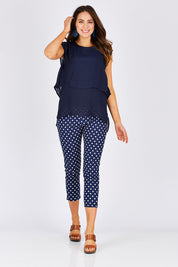 Model Madeline wearing size S of the Layered Top in colour Navy (Blue), from the front, showing the whole outfit