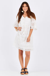 Model Monique wearing size S of the Lace Dress in colour White (White), from the front, showing the whole outfit