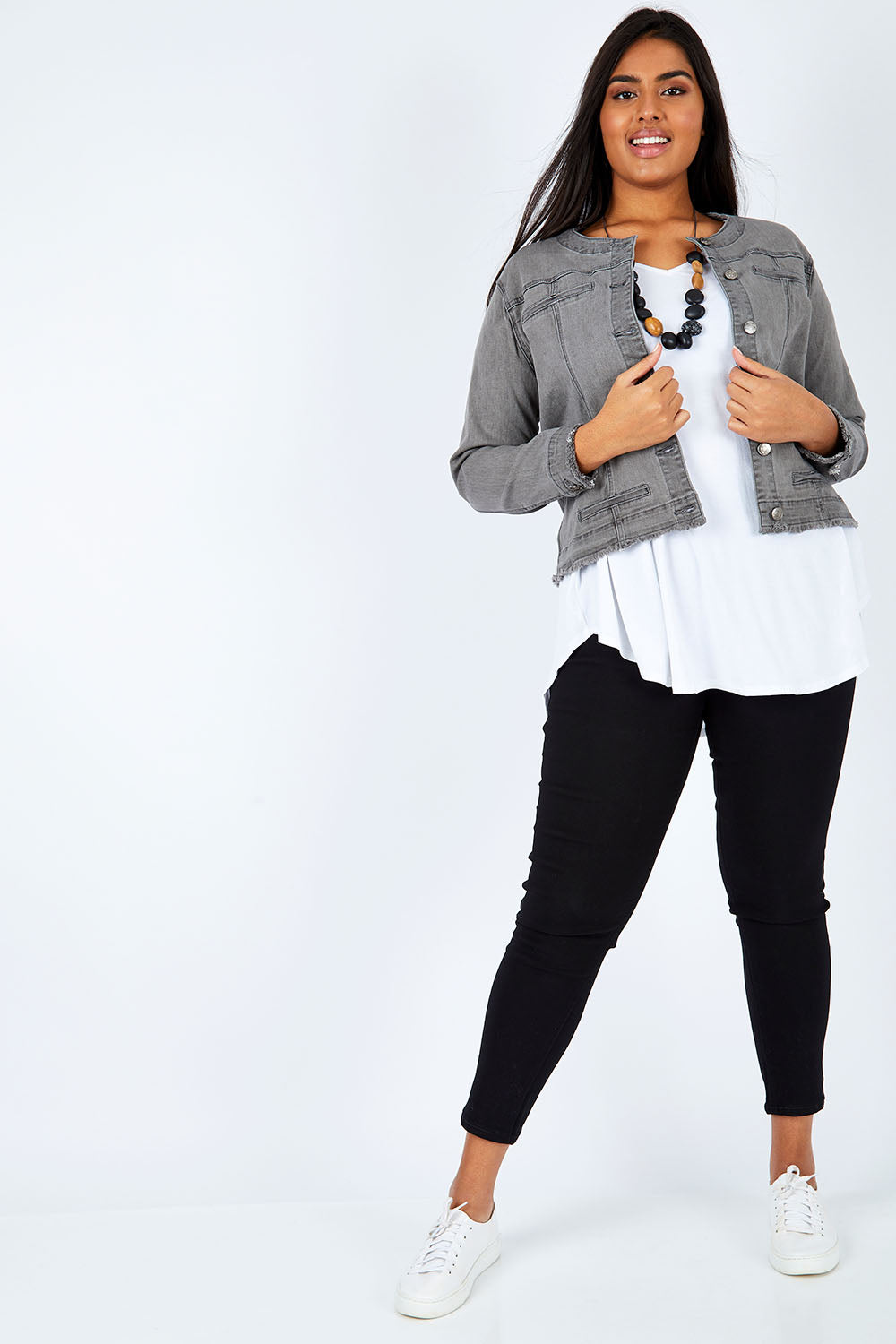 Model Shanaya wearing size L of the Collarless Jacket in colour Charcoal (Grey), from the front, showing the whole outfit