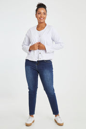 Model Noli wearing size L of the Collarless Jacket in colour White (White), from the front, showing the whole outfit