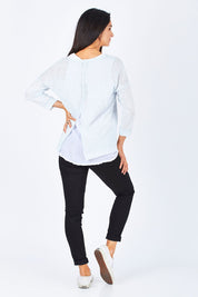 Model Gemma wearing size S of the Foil Striped 2 In 1 Top in colour Blue (Blue), from the back