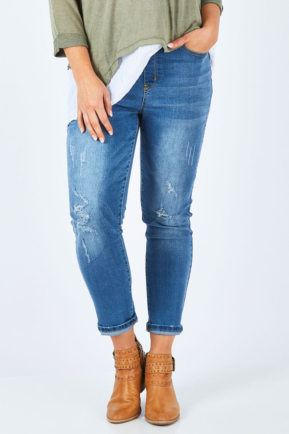 Model Shadae wearing size S of the Pull On Ripped Jeans in colour Denim (Blue), from the front, cropped image