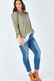 Model Shadae wearing size S of the Pull On Ripped Jeans in colour Denim (Blue), from the front, showing the whole outfit