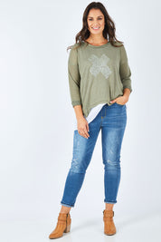 Model Shadae wearing size S of the Pull On Ripped Jeans in colour Denim (Blue), from the front, showing the whole outfit