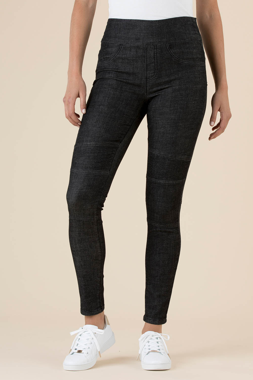 A model wearing the Battered Pull On Jean in colour Black (Black), from the front, cropped image