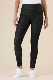 A model wearing the Battered Pull On Jean in colour Black (Black), from the front, cropped image