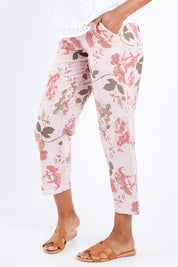 Model Schanez wearing size S of the Pink Floral Pant in colour Pink (Pink), from the front, cropped image