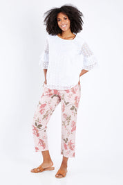 Model Schanez wearing size S of the Pink Floral Pant in colour Pink (Pink), from the front, showing the whole outfit