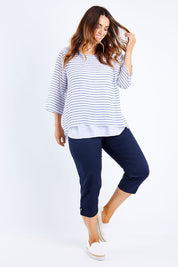 Model Laura wearing size L of the Santorini Cotton Pant in colour Navy (Blue), from the front, showing the whole outfit