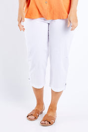 Model Laura wearing size L of the Santorini Cotton Pant in colour White (White), from the front, cropped image