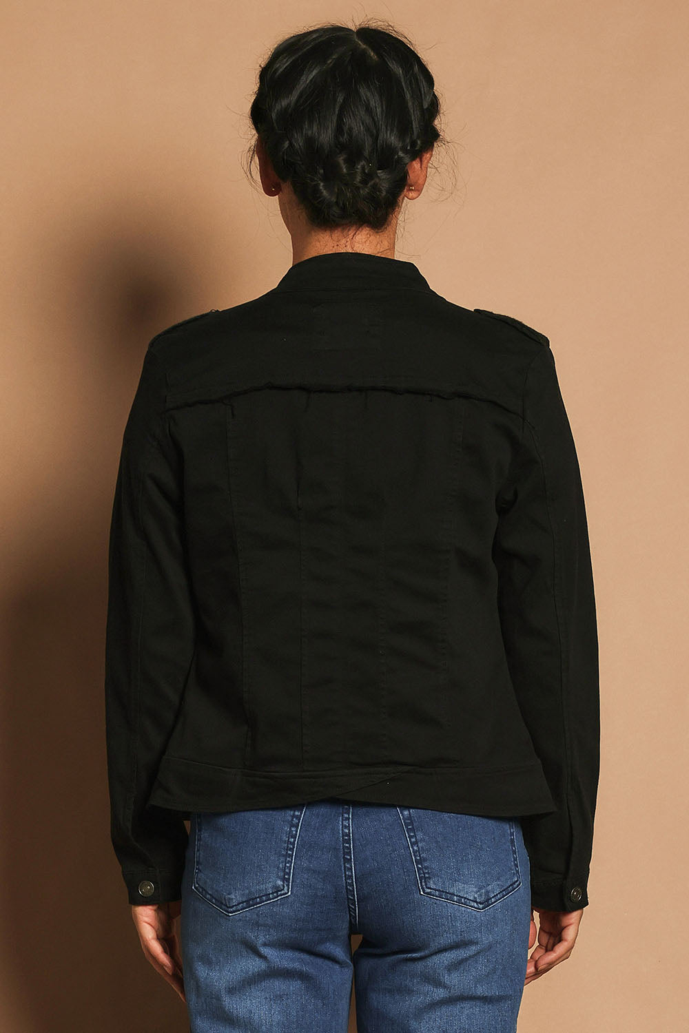 Model Katie wearing size S of the Military Denim Jacket in colour Black (Black), from the back