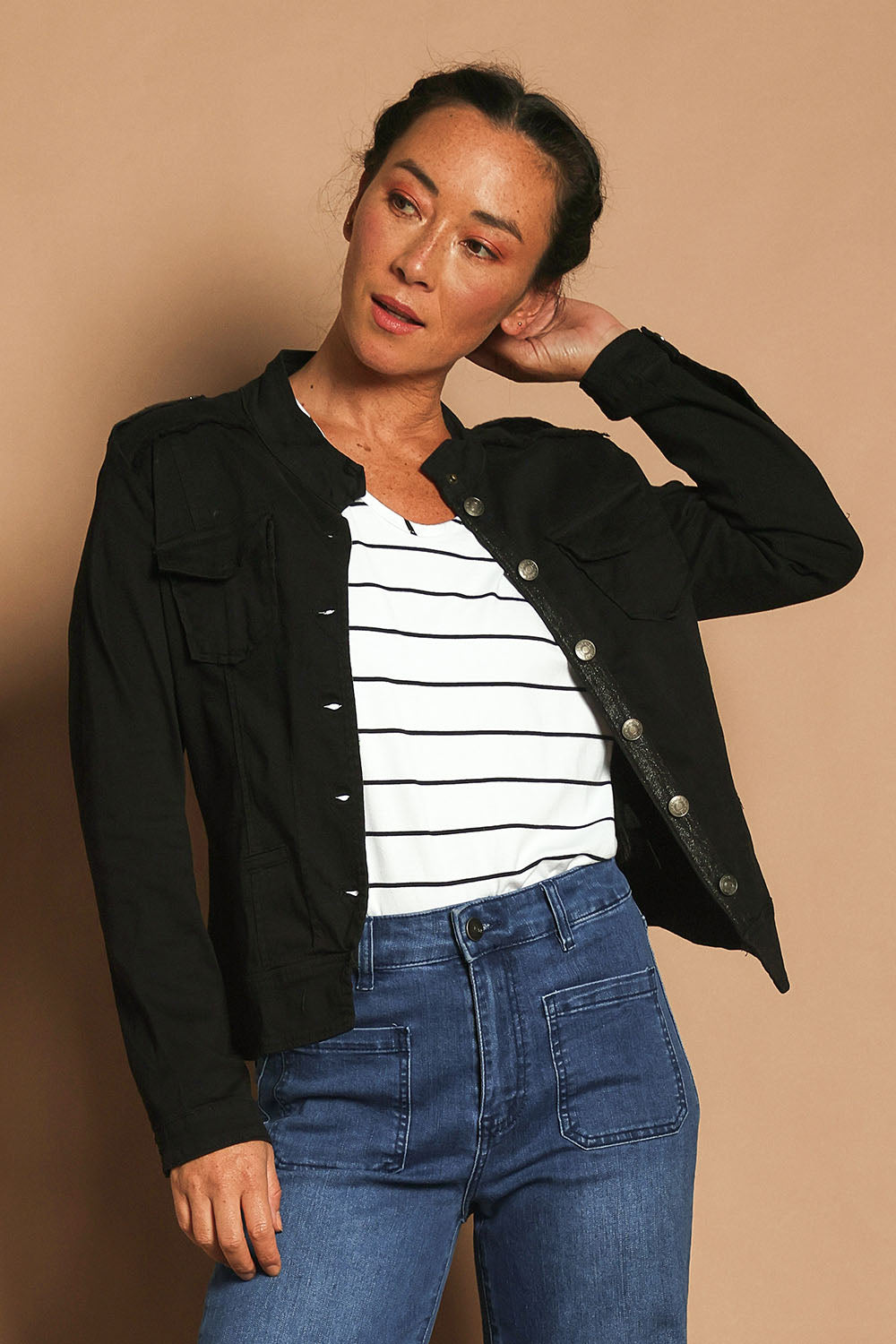 Model Katie wearing size S of the Military Denim Jacket in colour Black (Black), from the front, showing the whole outfit