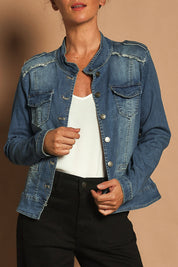 Model Katie wearing size S of the Military Denim Jacket in colour Denim (Blue), from the front, cropped image