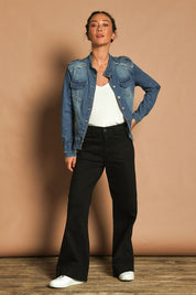 Model Katie wearing size S of the Military Denim Jacket in colour Denim (Blue), from the front, showing the whole outfit