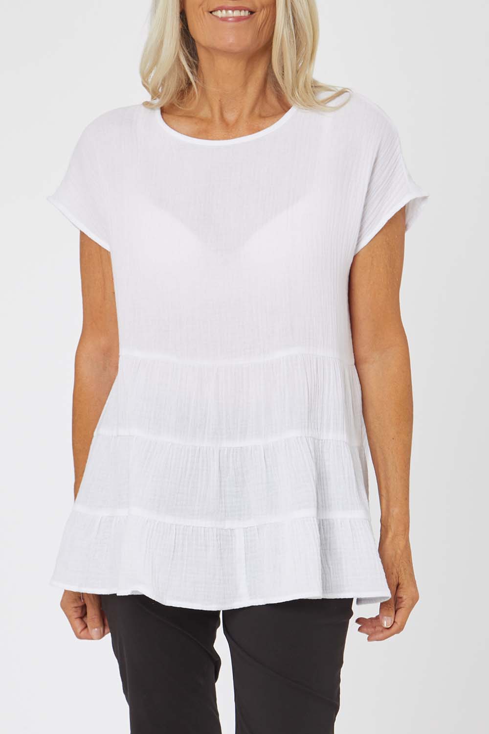 Model Rachel wearing size S of the Tiered Tunic in colour White (White), from the front, cropped image