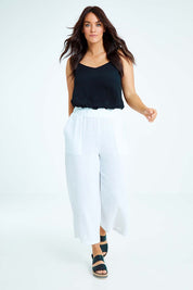 Model Laura wearing size L of the Cotton Pant in colour White (White), from the front, showing the whole outfit