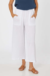 Model Rachel wearing size S of the Cotton Pant in colour White (White), from the front, cropped image