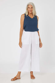 Model Rachel wearing size S of the Cotton Pant in colour White (White), from the front, showing the whole outfit