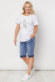 A model wearing the Jogger Short in colour Denim (Blue), from the front, showing the whole outfit