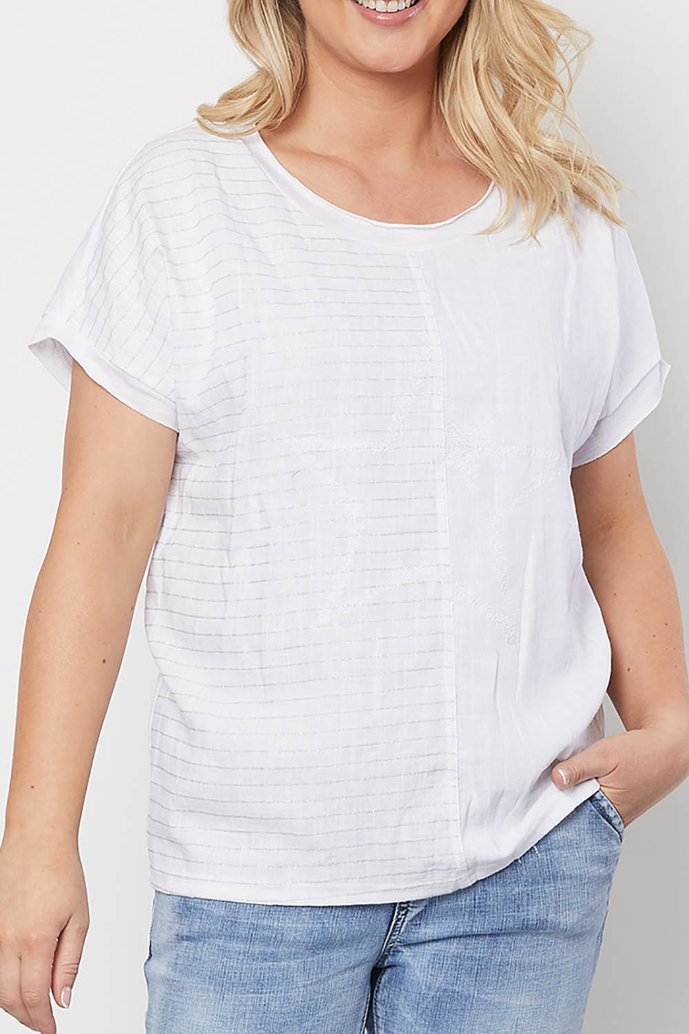A model wearing the Star Print Top in colour White (White), from the front, cropped image