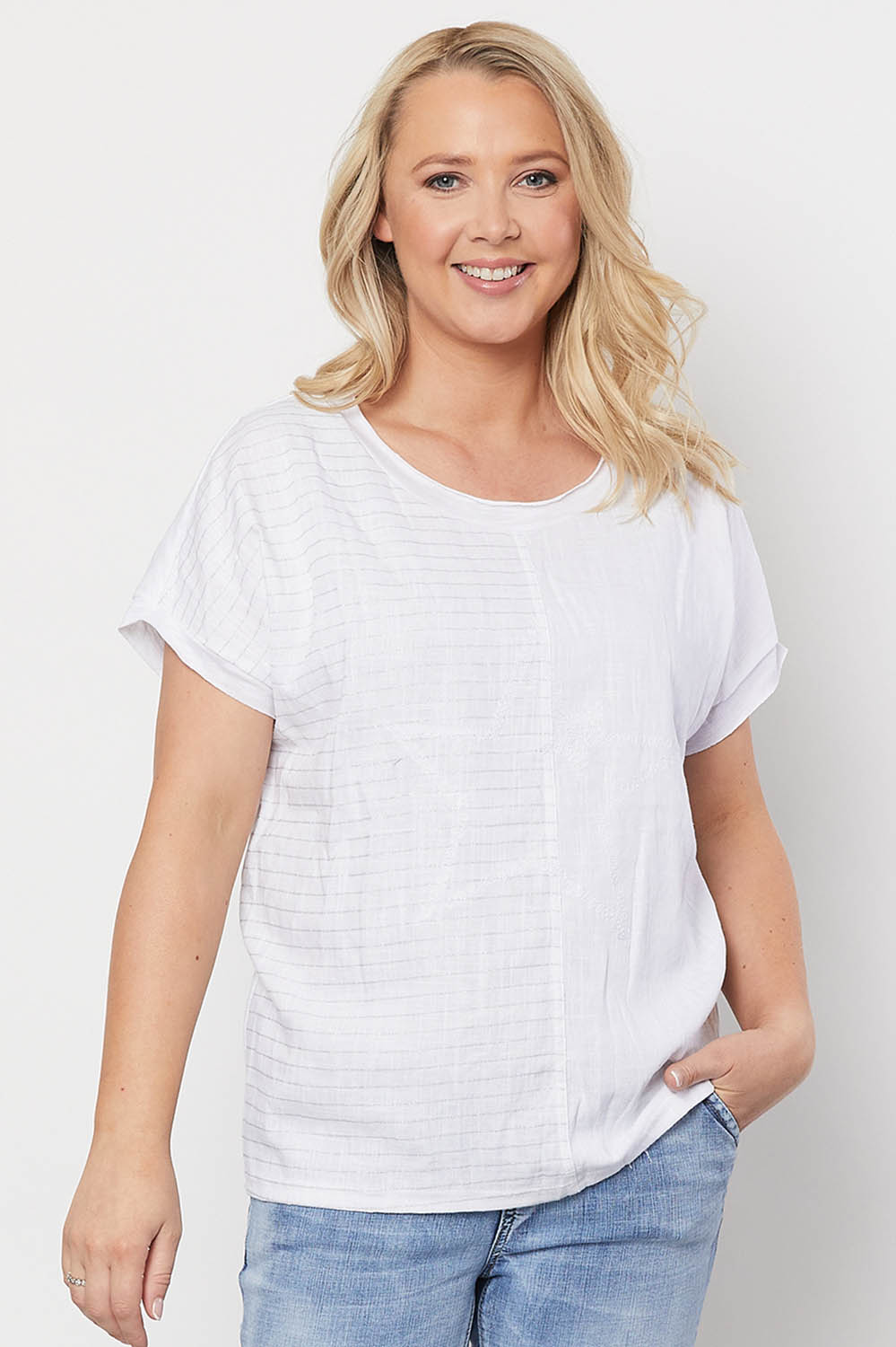 A model wearing the Star Print Top in colour White (White), from the front, cropped image