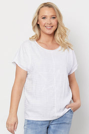 A model wearing the Star Print Top in colour White (White), from the front, cropped image
