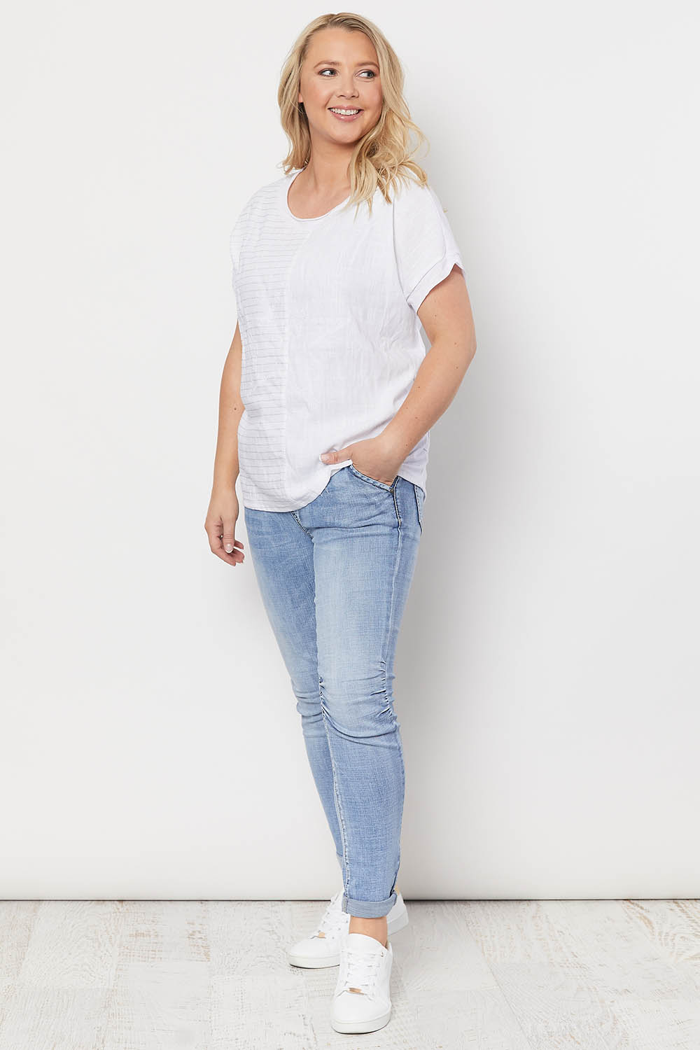 A model wearing the Star Print Top in colour White (White), from the front, showing the whole outfit