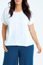 Model Laura wearing size L of the Star Print Top in colour White (White), from the front, cropped image