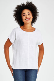 Model Olivia wearing size S of the Star Print Top in colour White (White), from the front, cropped image