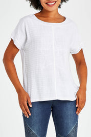 Model Olivia wearing size S of the Star Print Top in colour White (White), from the front, cropped image
